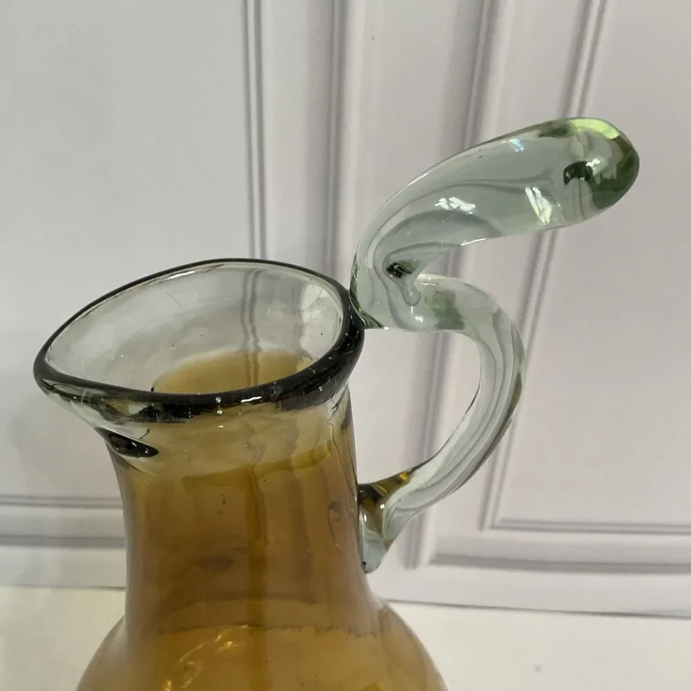 Hand Blown Glass Amber Pitcher with attached Clear Handle 10.5”Tall Clear Base
